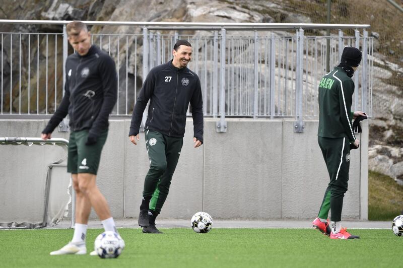 AC Milan's forward Zlatan Ibrahimovic, centre, attends a training session of Swedish league team Hammarby IF at Arsta IP in Stockholm on Monday. AFP