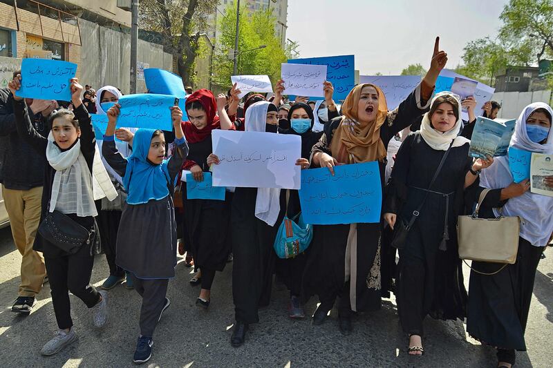 Afghan women and girls take part in a protest in front of the Ministry of Education in Kabul demanding that high schools be reopened to girls. On Wednesday, the Taliban-led ministry said girls in Grade 6 classes and above would not yet be called back to their classrooms. All photos: AFP