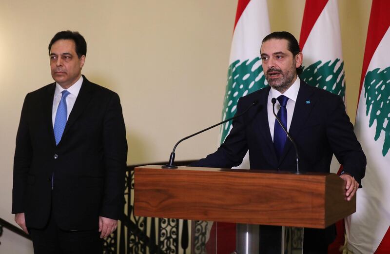 Lebanon's Prime Minister-designate Saad al-Hariri speaks as he stands near Lebanon's caretaker Prime Minister Hassan Diab at the governemt palace in Beirut, Lebanon, December 11, 2020. REUTERS/Mohamed Azakir
