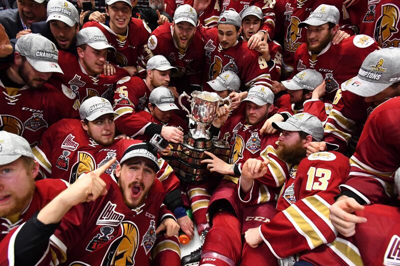 The Acadie-Bathurst Titan team poses with the Memorial Cup as they celebrate defeating the Regina Pats 3-0 in the Memorial Cup hockey final, in Regina, Saskatchewan, Canada. Jonathan Hayward / AP Photo