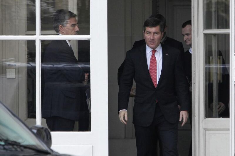 US ambassador to France Charles Rivkin, right, leaves the Foreign Ministry in Paris, after he was summoned to explain why the Americans spied on one of their closest allies. Monday, Oct. 21, 2013. Claude Paris / AP