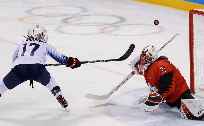 Jocelyne Lamoureux of the US (L) misses a penalty shot against Canada goalkeeper Genevieve Lacasse in the Women Preliminary Round Match - US v Canada. David W Cerny / Reuters