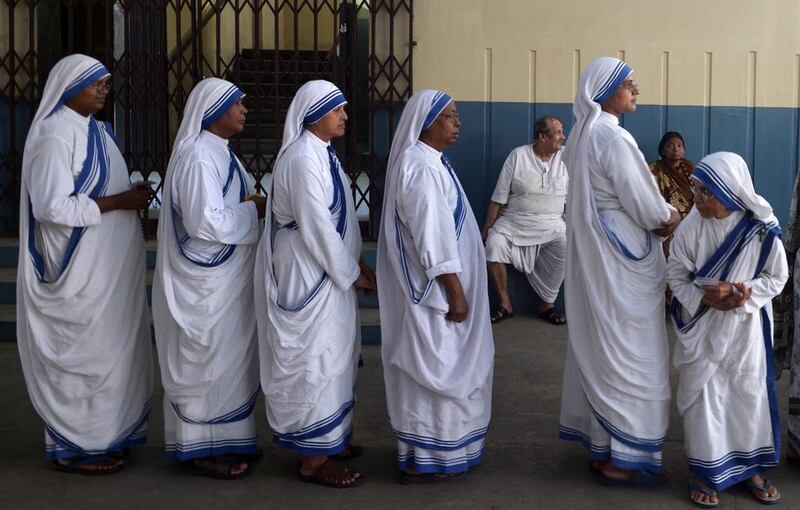 Nuns from The Missionaries of Charity queue as they wait to cast their vote during the final phase of India’s national elections in Kolkat. India’s 814-million-strong electorate is voting in the world’s biggest election which is set to sweep the Hindu nationalist opposition to power at a time of low growth, anger about corruption and warnings about religious unrest. Dibyangshu Sarkar / AFP
