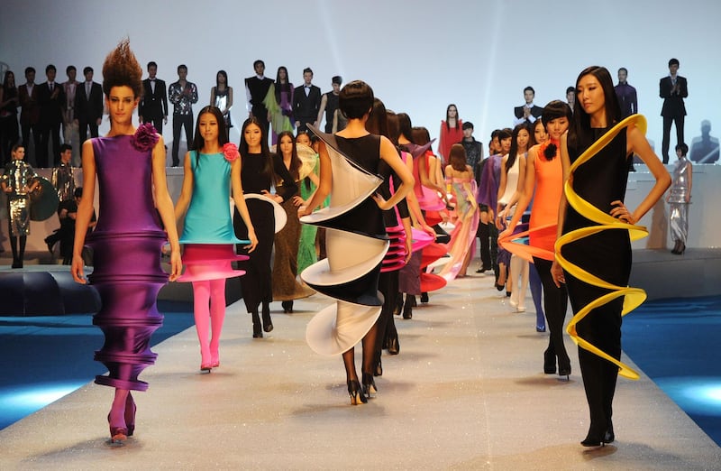 Models walk the finale of the Pierre Cardin Fashion Show 2012 at the Water Cube in Beijing in April 2012. AFP