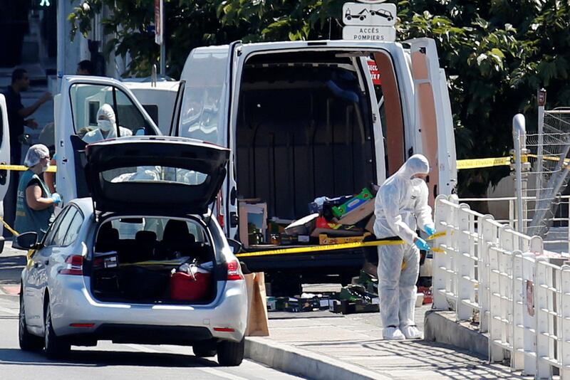 French police conduct their investigation in the French port city of Marseille after one person was killed and another injured after a vehicle crashed into two bus shelters, in Marseille. Philippe Laurenson / Reuters