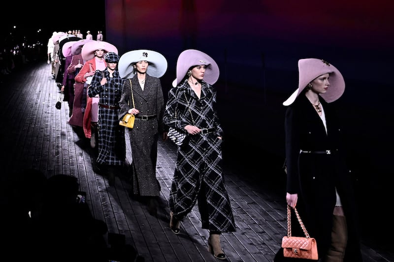 Models present creations at Chanel's ready-to-wear, autumn-winter 2024/2025 show at Paris Fashion Week. AFP