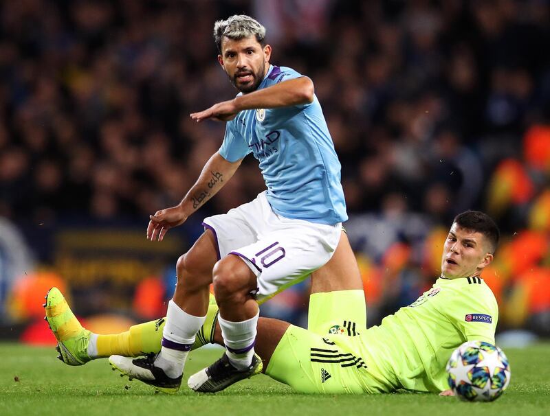 Manchester City striker Sergio Aguero escapes the challenge of Dino Peric. Getty Images