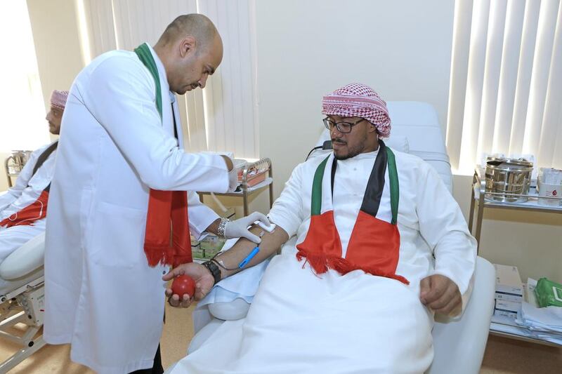 Fahad Khamis, a soldier, donates blood at the Sharjah Blood Transfusion and Research Centre, which is open during public holidays. Jeffrey E Biteng / The National