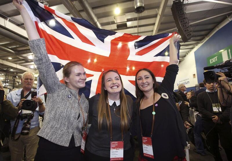 Supporters from the “No” Campaign celebrate as they hold up a Union flag. Paul Hackett / Reuters