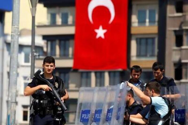 Turkish police stand guard at the entrance of Gezi Park at Istanbul’s Taksim Square, where 441 people were detained on Sunday.