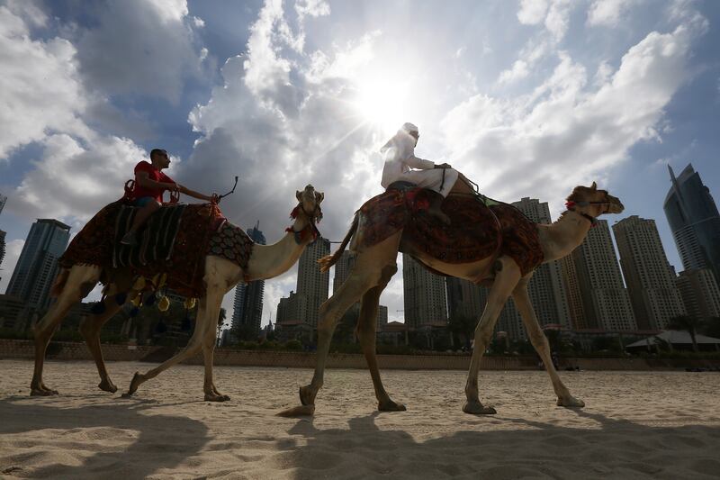 DUBAI , UNITED ARAB EMIRATES Ð Feb 27 , 2015 : One of the tourist taking his selfie at the JBR beach near Ritz Carlton hotel in Dubai. ( Pawan Singh / The National ) For Focal Point *** Local Caption ***  PS2702- FOCAL POINT01.jpg