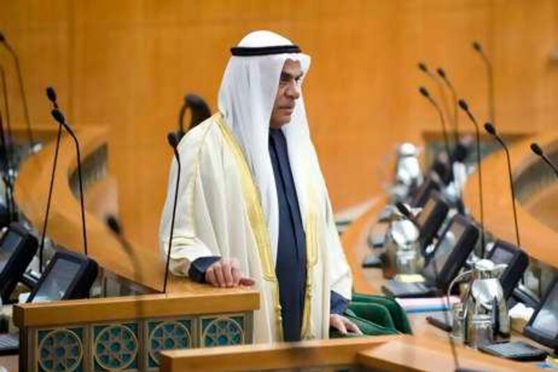 Kuwait's Member of Parliament Ahmed al-Sadoun stands amongst empty chairs in Parliament at the National Assembly building in Kuwait city December 16, 2008. The regular session was postponed until December 30 after Kuwait's ruler accepted the resignation of the government in a bid to end a crisis with parliament, but reappointed his nephew as prime minister, according to the speaker of the assembly.  REUTERS/Stephanie McGehee (KUWAIT) *** Local Caption ***  KUW05_KUWAIT-GOVERN_1216_11.JPG