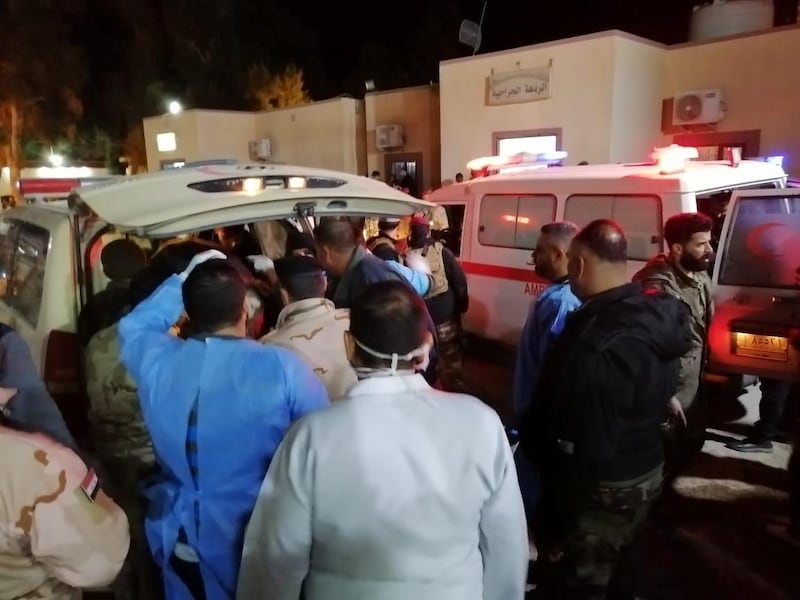 An ambulance transports wounded members to hospital. Reuters