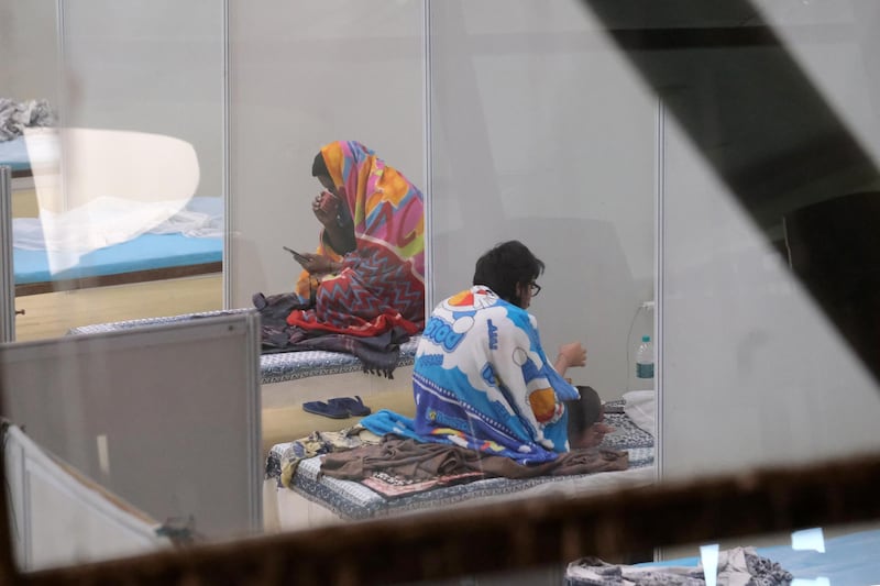 Patients inside a Covid-19 ward set up at the Commonwealth Games Village Sports Complex in New Delhi. Bloomberg