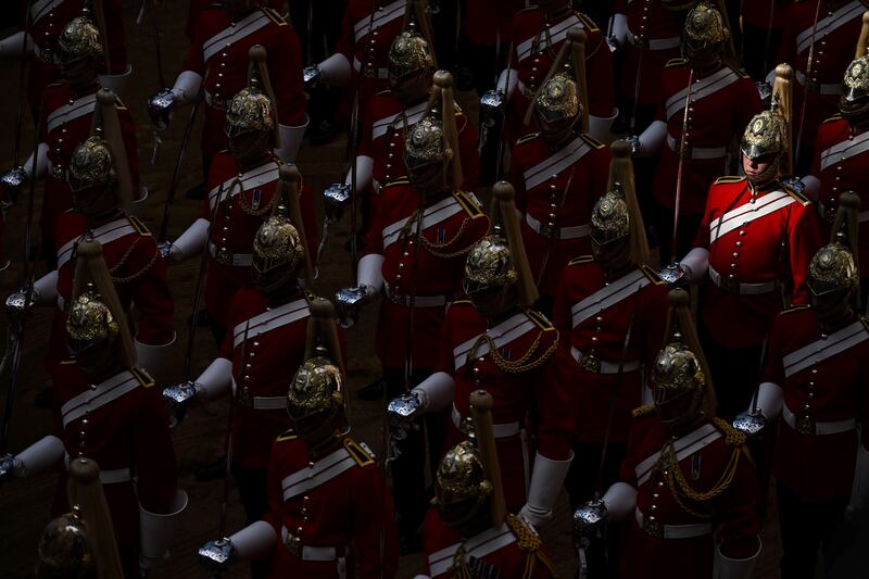 Life Guards, a unit of the Household Cavalry, stand guard outside the Palace of Westminster. Getty Images