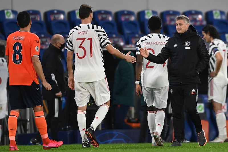 Coach Ole Gunnar Solskjaer shakes hands with Nemanja Maticat. AFP