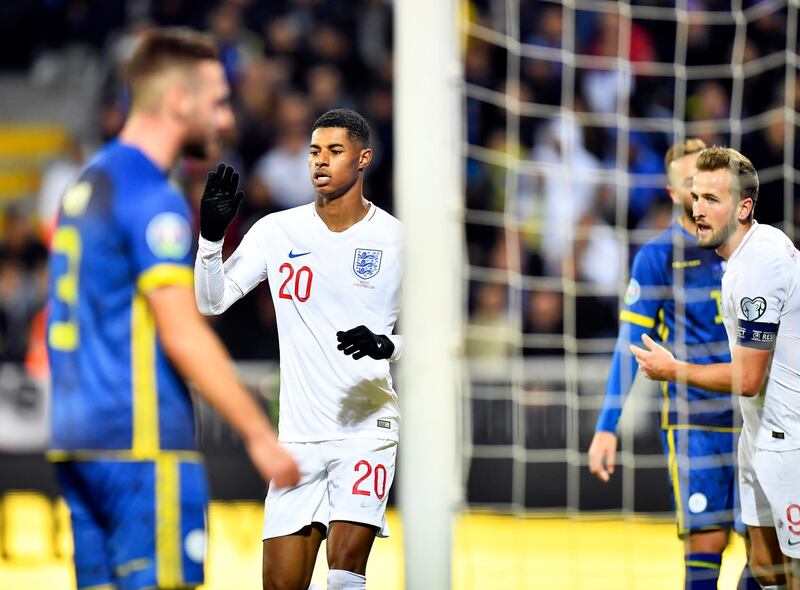 England's Marcus Rashford reacts after scoring. EPA