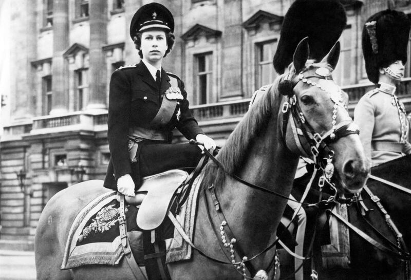 Princess Elizabeth mounted on Winston, a chestnut police horse, in the forecourt of Buckingham Palace, London, in 1949 as part of King George VI's official 53rd birthday. Reuters