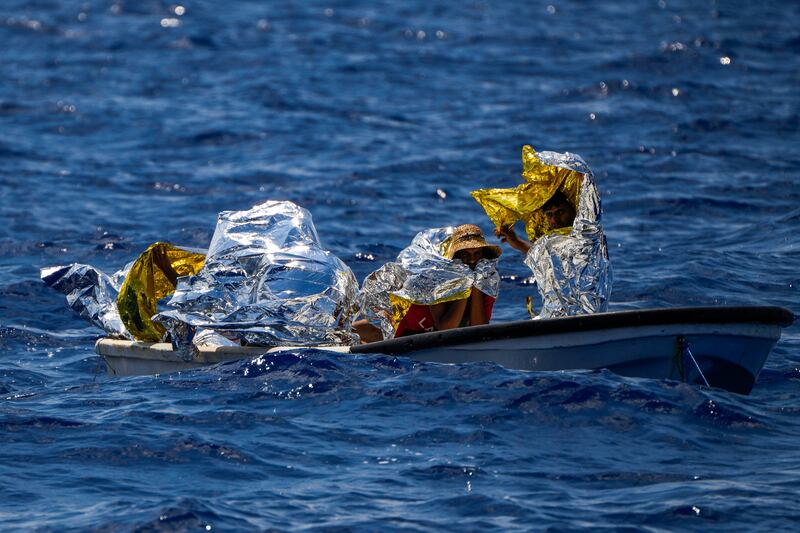 Migrants from Syria and Libya wait to be rescued south of the Italian island of Lampedusa in the Mediterranean on Wednesday. AP