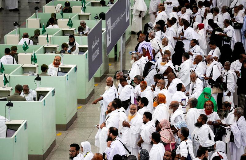 Muslim worshippers queue for immigration and passport control at the Hajj terminal of the King Abdulaziz international airport in Jeddah. About 2.6 million Muslims are expected to attend this year's Hajj pilgrimage. Mast Irham / EPA