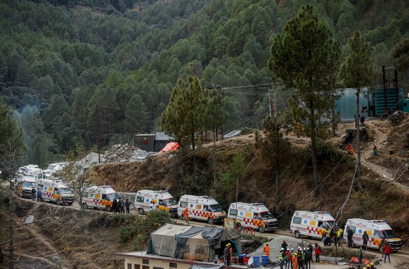 Ambulances wait in line during rescue operations to save workers trapped in the collapsed tunnel. Reuters