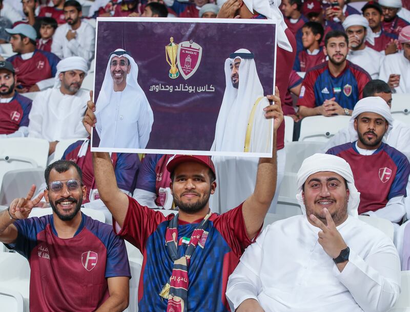 Al Wahda FC fans cheer during the President’s Cup finals at the Hazza bin Zayed Stadium in Al Ain. Victor Besa / The National