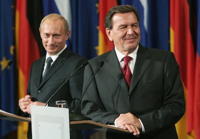 Vladimir Putin and Gerhard Schroeder in Berlin in September 2005, when they signed a deal for a Baltic gas pipeline. Getty 