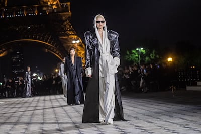 Models walk the runway for the spring/summer 2023 ready-to-wear collection by Saint Laurent. EPA 