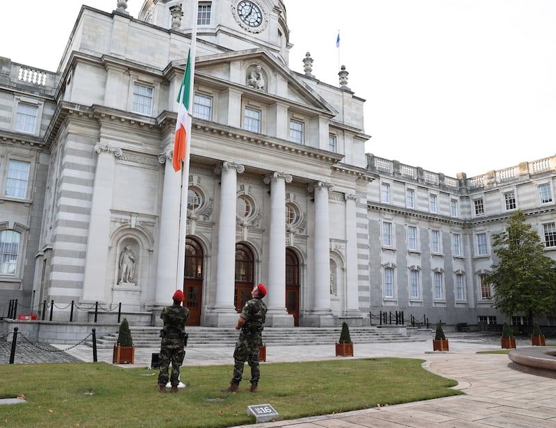  Defence Forces military police lower the Irish flag to half mast outside government buildings in Dublin following the announcement of the death of Queen Elizabeth II. PA