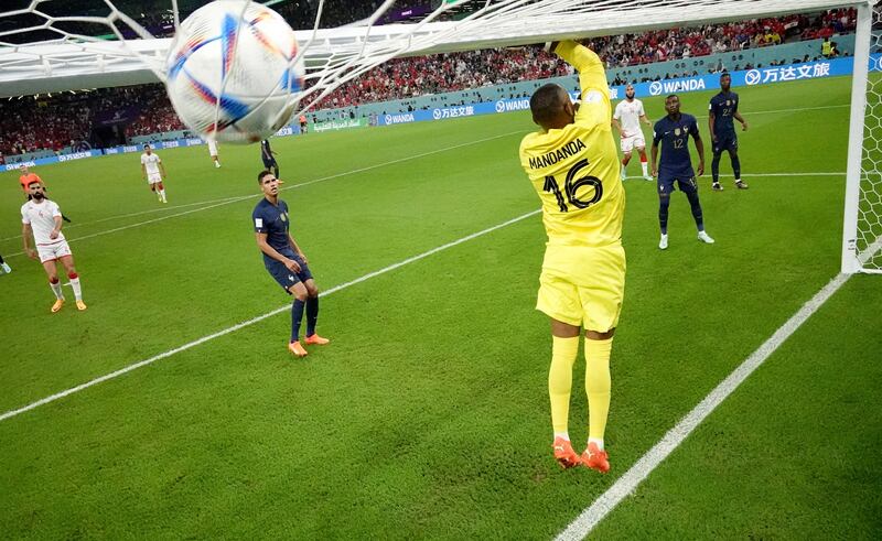 France goalkeeper Steve Mandanda sees one over the bar in the final Group D match against Tunisia. Getty 