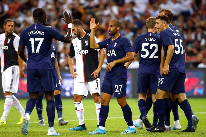 Tottenham players congratulate Lucas Moura, centre, on his goal. Reuters