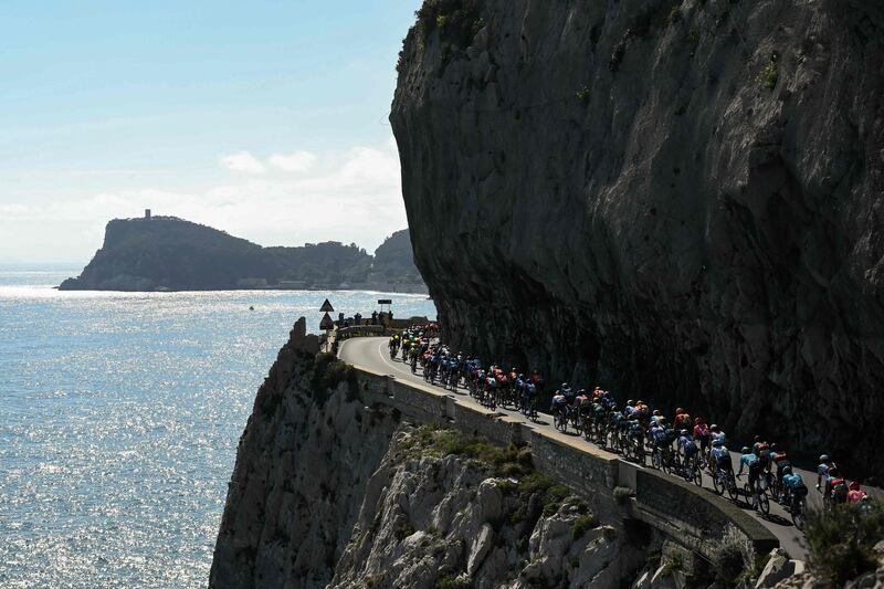 The pack rides along Capo Noli during the Milan-SanRemo one-day classic cycling race, between Pavia and SanRemo. AFP