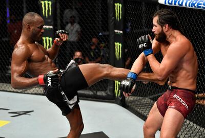 ABU DHABI, UNITED ARAB EMIRATES - JULY 12: In this handout image provided by UFC, (L-R) Kamaru Usman of Nigeria kicks Jorge Masvidal in their UFC welterweight championship fight during the UFC 251 event at Flash Forum on UFC Fight Island on July 12, 2020 on Yas Island, Abu Dhabi, United Arab Emirates. (Photo by Jeff Bottari/Zuffa LLC via Getty Images)