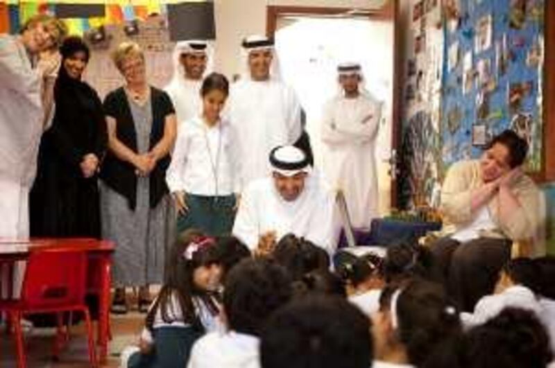 ABU DHABI, UNITED ARAB EMIRATES - May 11, 2010: (center) HH General Sheikh Mohamed bin Zayed Al Nahyan, Crown Prince of Abu Dhabi, Deputy Supreme Commander of the UAE Armed Forces tours Sheikh Zayed Private Academy for Girls with his daughter (center left) HH Sheikha Hessa bin Mohamed bin Zayed Al Nahyan and (center top) HE Dr Mugheer Al Khaili, Director General Abu Dhabi Education Council. 
( Ryan Carter / Crown Prince Court - Abu Dhabi )