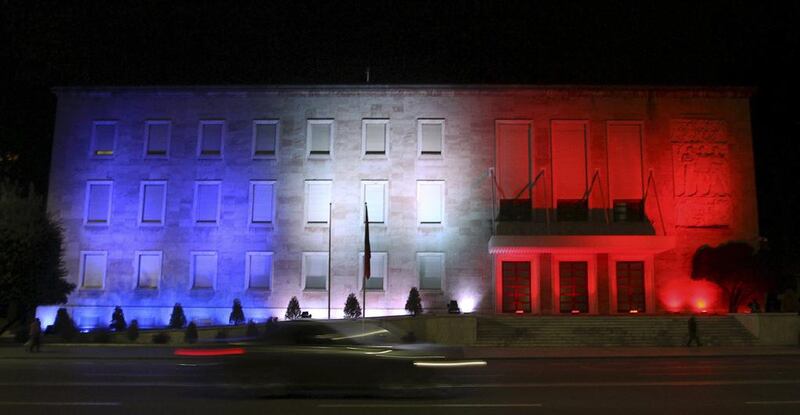 Following the attacks in Paris, the blue, white and red colours of France's national flag are projected at the government building in Tirana, Albania on November 14, 2015         Arben Celi/ Reuters