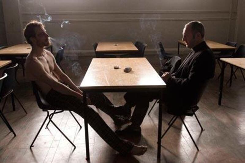 Michael Fassbender as Bobby Sands and Liam Cunningham as Father Moran in Steve McQueen's masterfully shot, albeit slow-paced, Hunger.