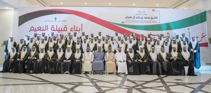 Sheikh Mohammed bin Zayed with the grooms. With them are Sheikh Tahnoon bin Mohammed Al Nahyan, front row 10th right, Sheikh Abdulaziz bin Humaid bin Rashid Al Nuaimi, front row eight right, and Bakhit bin Suaidan Al Nuaimi, front row seventh right. Mohamed Al Hammadi / Crown Prince Court - Abu Dhabi