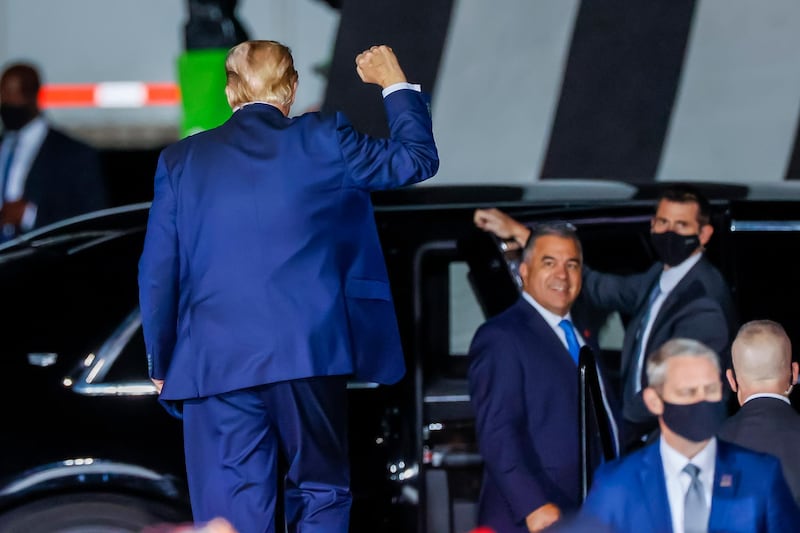 US President Donald J. Trump gestures to supporters after speaking at his Make America Great Again Rally campaign event at Middle Georgia Regional Airport. EPA