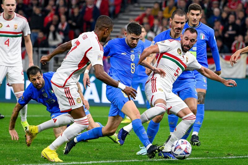 Italy's Jorginho, centre, in action against Hungary's Attila Fiola, center right, and Loic Nego, center left. AP