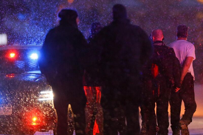 A suspect is led away in handcuffs by police during an active shooter situation outside a Planned Parenthood facility where an active shooter reportedly injured up to eleven people, including at least five police officers, on November 27 in Colorado Springs, Colorado. Justin Edmonds/AFP