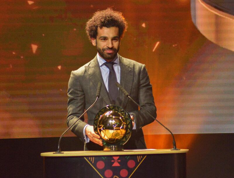 epa07270180 Mohamed Salah from Egypt receives the Player of the Year award during the Confederation of African Football (CAF) awards at the Abdou Diouf International Conference Center in Dakar, Senegal 08 January 2019.  EPA/STR