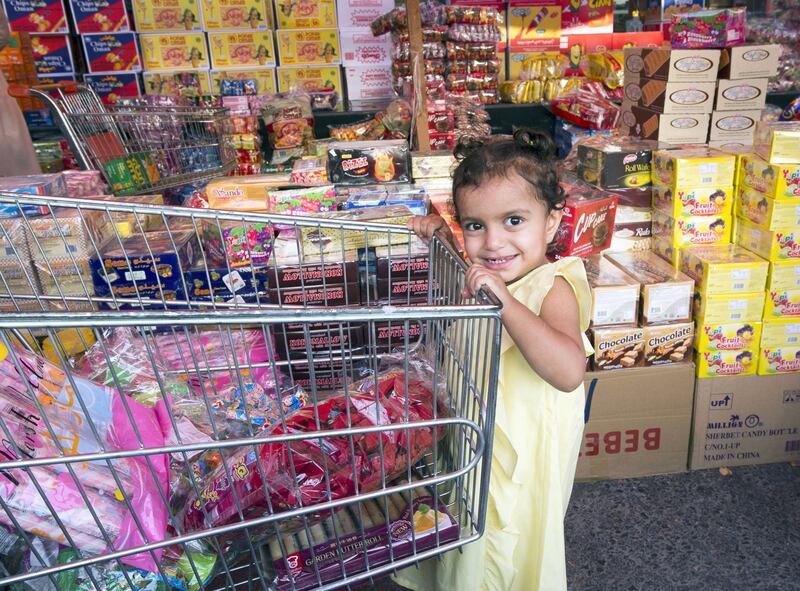 RAS AL KHAIMAH, UNITED ARAB EMIRATES, 26 APRIL 2018- Locals buying sweets in Saif Mirza store one of the stores selling sweets and nuts for Hag Al Leila in Ras Al khaimah. Leslie Pableo for The National for Anna Zackarias story