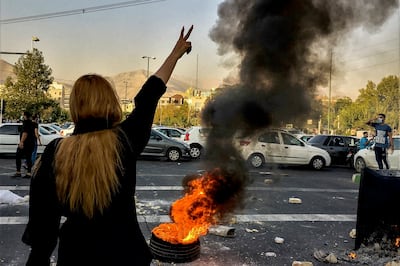 Iranians protest the death of 22-year-old Mahsa Amini after she was detained by the morality police in October 2022. AP