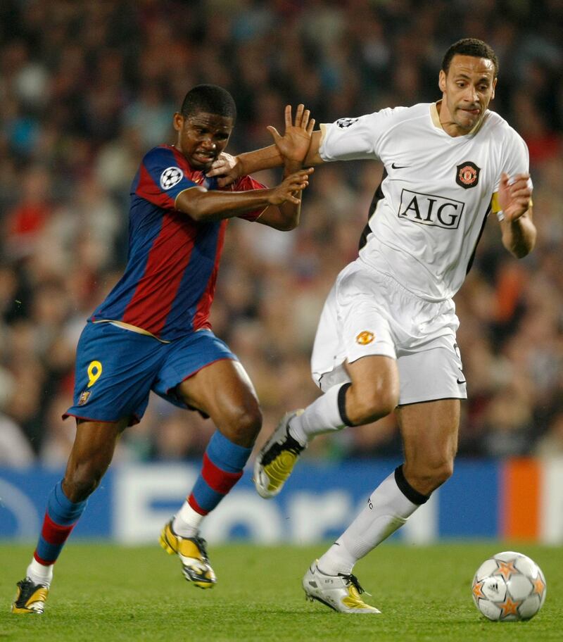 FILE PHOTO: Barcelona's Samuel Eto'o (L) challenges Manchester United's Rio Ferdinand for the ball during their Champions League semi-final first leg soccer match at the Camp Nou stadium in Barcelona, April 23, 2008.     REUTERS/Albert Gea/File Photo