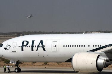 Hundreds of Pakistanis who arrived on a Pakistan International Airlines flight were refused entry into Dubai for failing to meet tourist visa entry requirements. Asif Hassan / AFP