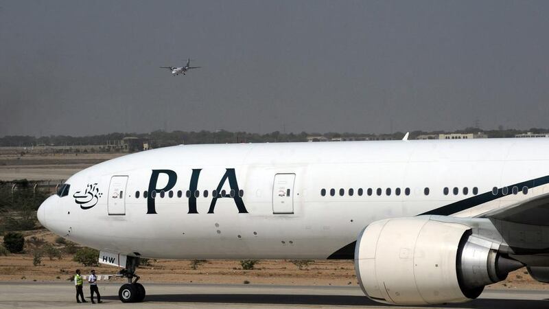 Hundreds of Pakistanis who arrived on a Pakistan International Airlines flight were refused entry into Dubai for failing to meet tourist visa entry requirements. Asif Hassan / AFP