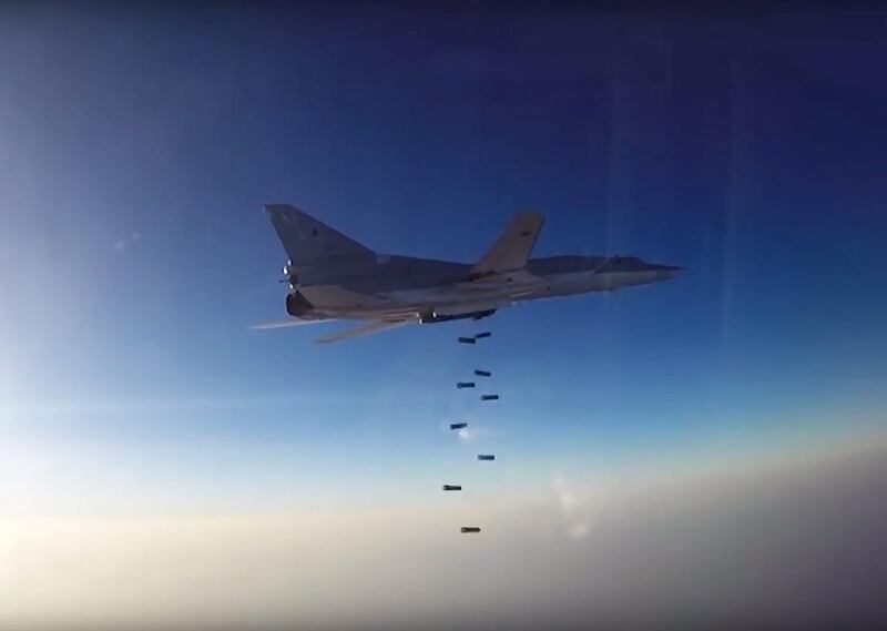 A Russian Tupolev-22M3 drops bombs on Jabhat Fatah Al Sham (formerly Jabhat Al Nusra) targets in Aleppo province on August 16, 2016, after taking off from the Hamedan air base in Iran. Russian Defence Ministry/Handout/EPA  