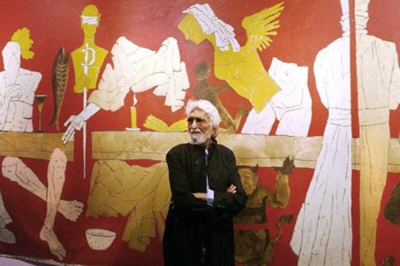 (FILES) In this photograph taken on January 14, 2004, Indian artist Maqbool Fida (M.F) Husain stands against one of his paintings titled 'Last Supper' at the inauguration of his exhibition '...and not only 88 of Hussain' at the National Art Gallery in Mumbai.    India's most famous modern artist M.F. Husain, who left the country in 2006 due to threats from Hindu extremists, died early June 9, 2011, in The Royal Brompton Hospital in London, media reports in New Delhi said, citing his family.  AFP PHOTO/SEBASTIAN D'SOUZA/FILES

