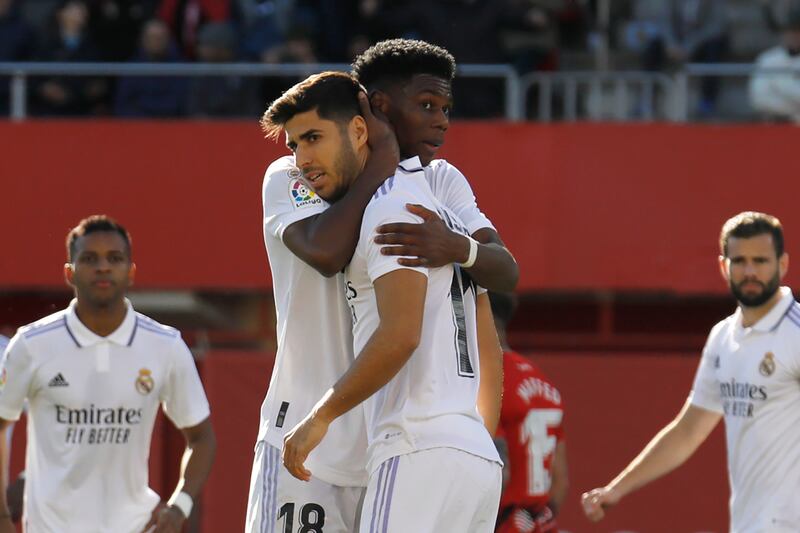 Real Madrid's Aurelien Tchouameni consoles Marco Asensio after he missed a penalty. AP