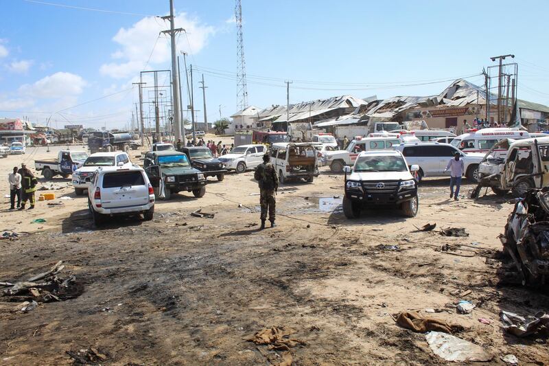 epa08092668 A security officer is seen at the scene of a  large explosion near a check point in Mogadishu, Somalia, 28 December 2019. A source at a hospital said that the death toll has risen to at least 76 in what is believed to have been a car bombing. The explosion rocked an area near the junction called Ex-Control Afgoye, in a southwestern suburb of the capital Mogadishu.  EPA/SAID YUSUF WARSAME
